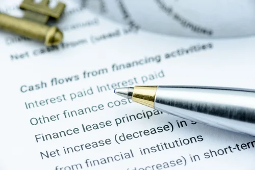 paper and pen with important banking and finance terms