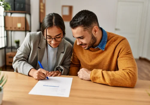 a couple signing a contract