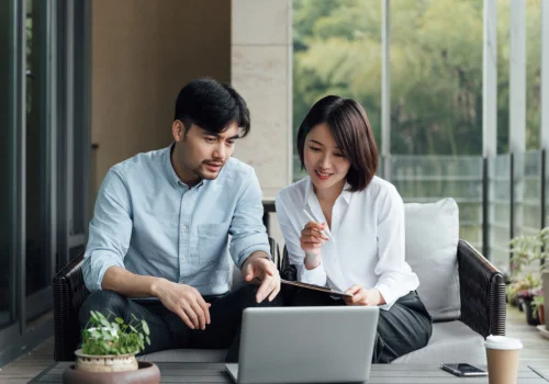 a couple using their laptop