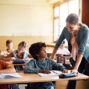 A teacher assisting a student 