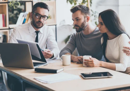 couple getting insurance with their agent.