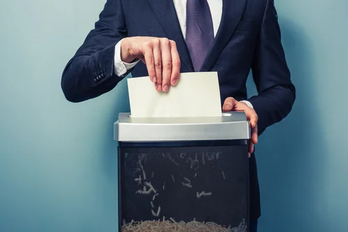Person shredding paper