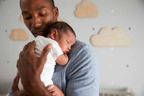 man holding baby