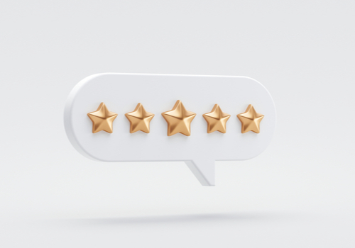 text bubble with five gold stars inside of it
