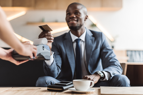 man making purchase with credit card