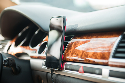 phone mounted inside of car on the dashboard