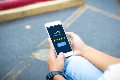 person looking at phone yelp reviews