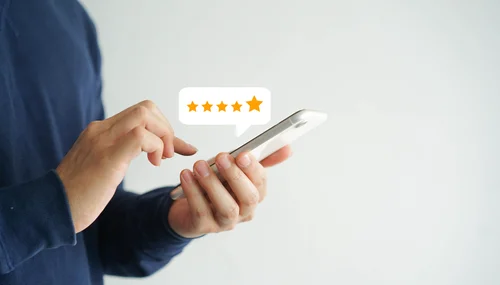 person looking at phone reviews